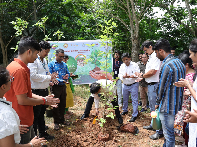 Volunteers planting trees at NISER, Jatni